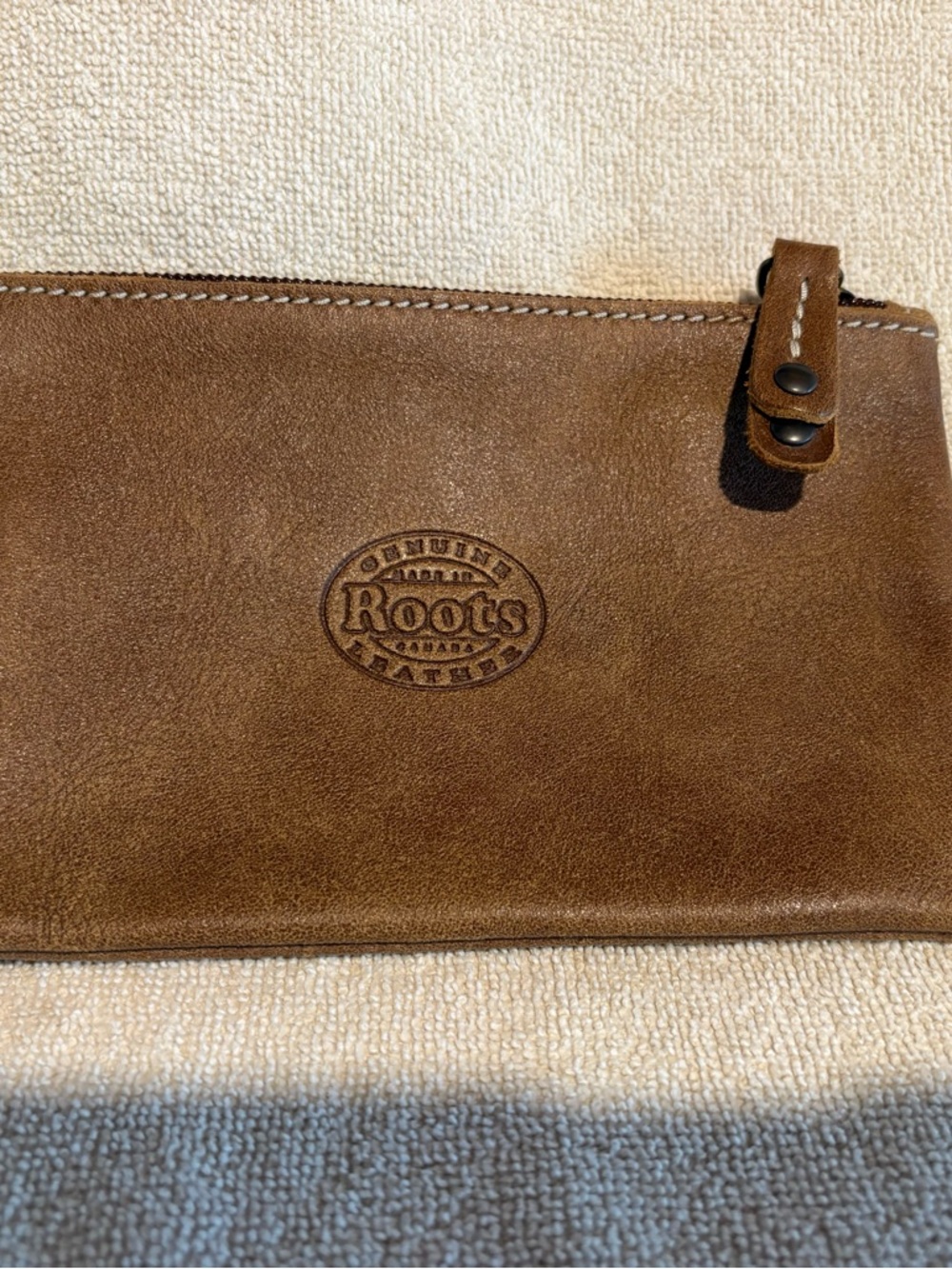 Roots Brown Leather Wristlet Clutch with Embossed Logo